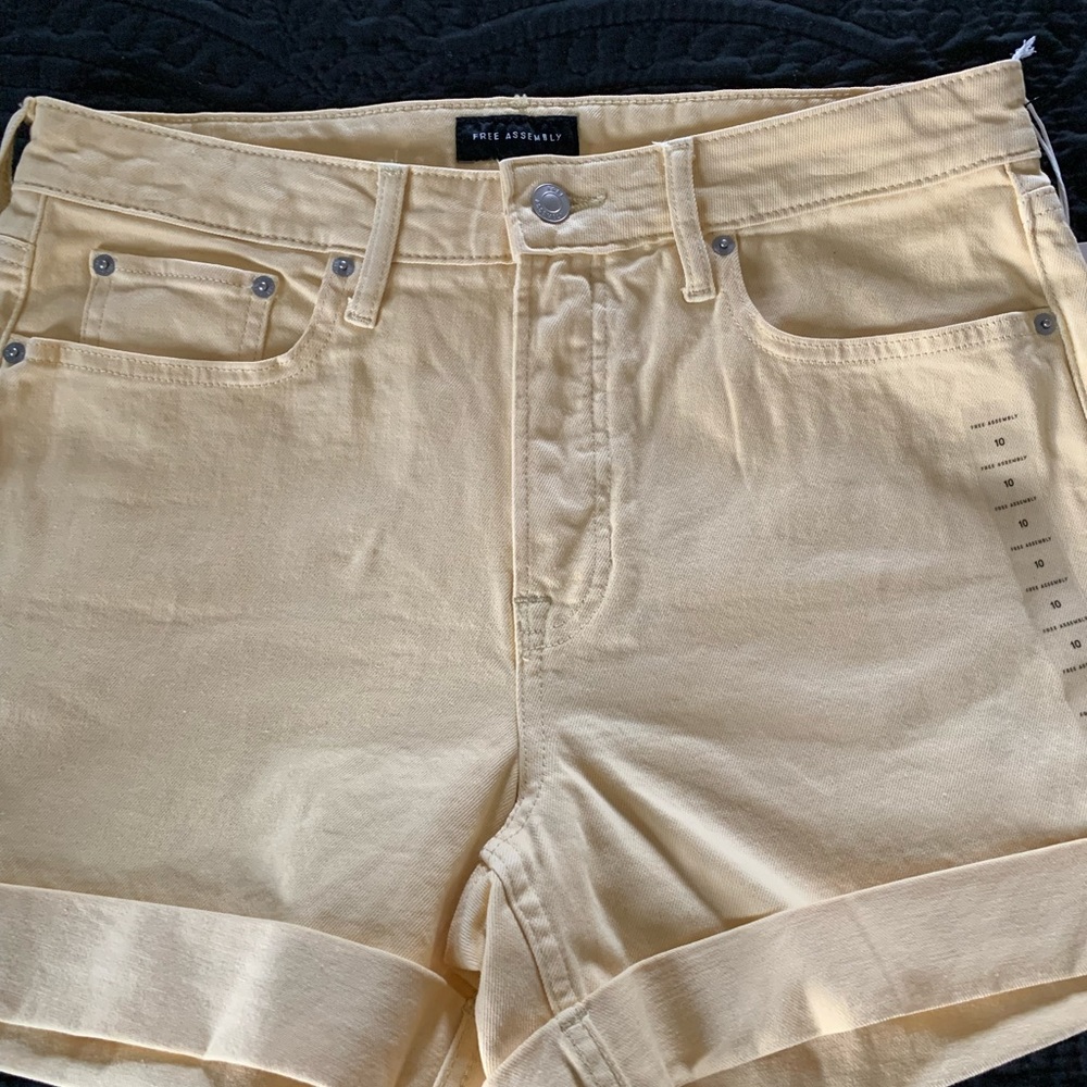 Brand new light yellow cuffed jean material shorts